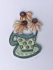 'blue cup with 3 daisies'