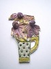 'small green jug with 3 daisies'